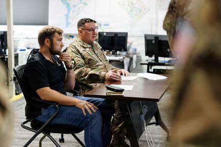 Alex Miller, the U.S. Army's Chief Technology Officer, meets with U.S. National Guardsmen assigned to Joint Task Force-District of Columbia, in support of the DC Safe and Beautiful mission, at the DC Armory in Washington, July 26, 2026. About 5,000 National Guard members are supporting the mission, providing critical assistance to the Metropolitan Police Department to help ensure the safety of residents, commuters, and visitors throughout the District.