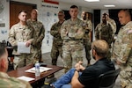 Alex Miller, the U.S. Army's Chief Technology Officer, talks with U.S. National Guardsmen assigned to Joint Task Force-District of Columbia, in support of the DC Safe and Beautiful mission, at the DC Armory in Washington, July 26, 2026. About 5,000 National Guard members are supporting the mission, providing critical assistance to the Metropolitan Police Department to help ensure the safety of residents, commuters, and visitors throughout the District.