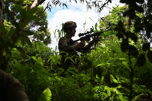 Security Forces Airmen assigned to the Ohio Air National Guard's 178th Security Forces Squadron prepare for an ambush exercise during annual training at Schofield Barracks, Hawaii, July 19, 2026. The training challenges Airmen to strengthen tactical proficiency, teamwork and expeditionary readiness while operating in unfamiliar terrain and austere conditions. (U.S. Air National Guard photo by Tech. Sgt. Tiffany Scofield)