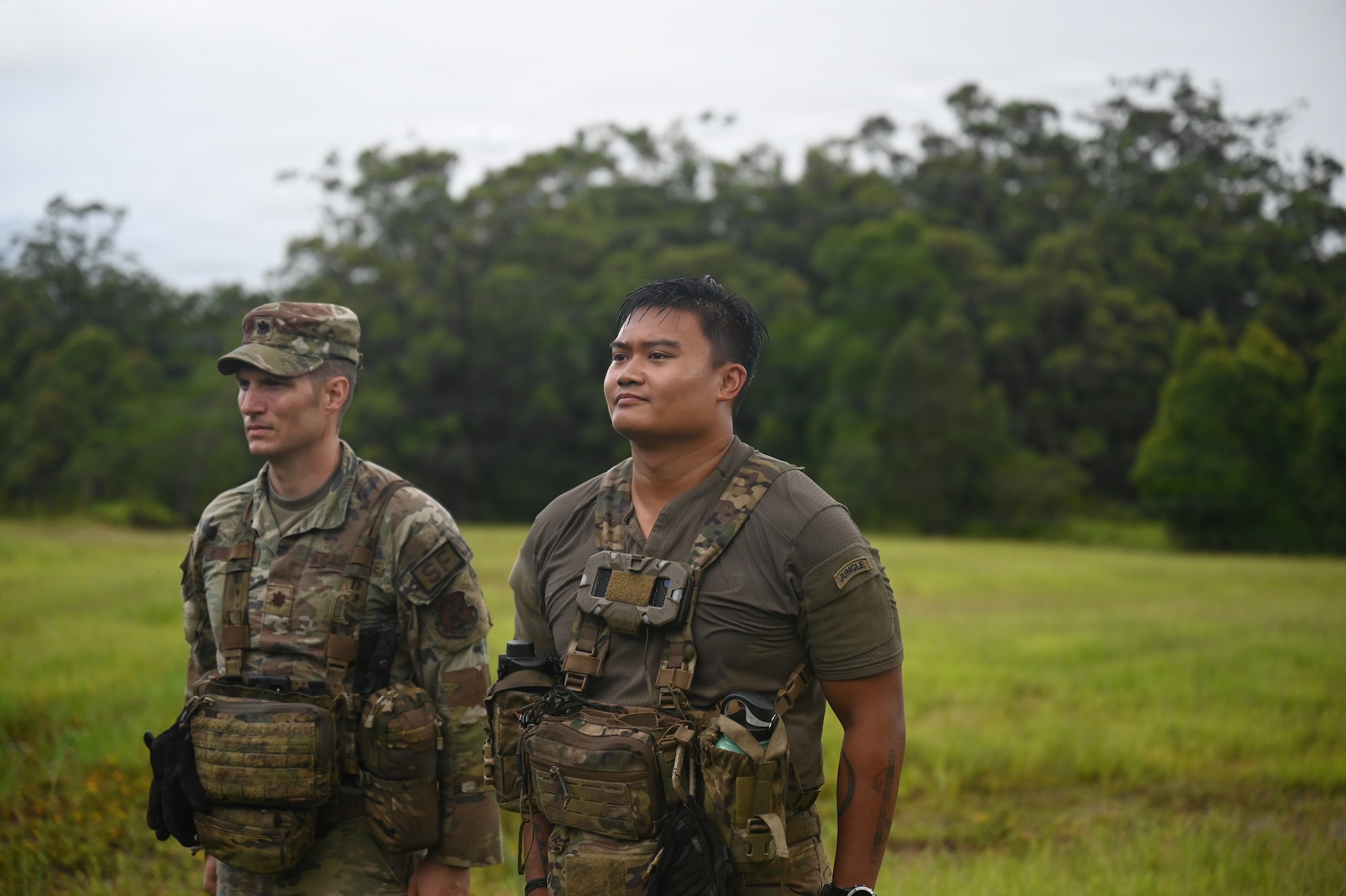 Maj. Eric Minshaw, commander of the 178th Security Forces Squadron, stands alongside 1st Lt. Kyle Mackerig, a guest jungle instructor from the 820th Base Defense Group at Moody Air Force Base, Georgia, during an award presentation at the conclusion of annual training at Schofield Barracks, Hawaii, July 23, 2026. Mackerig was awarded the Air and Space Commendation Medal for his contributions to the training. (U.S. Air National Guard photo by Tech. Sgt. Tiffany Scofield)