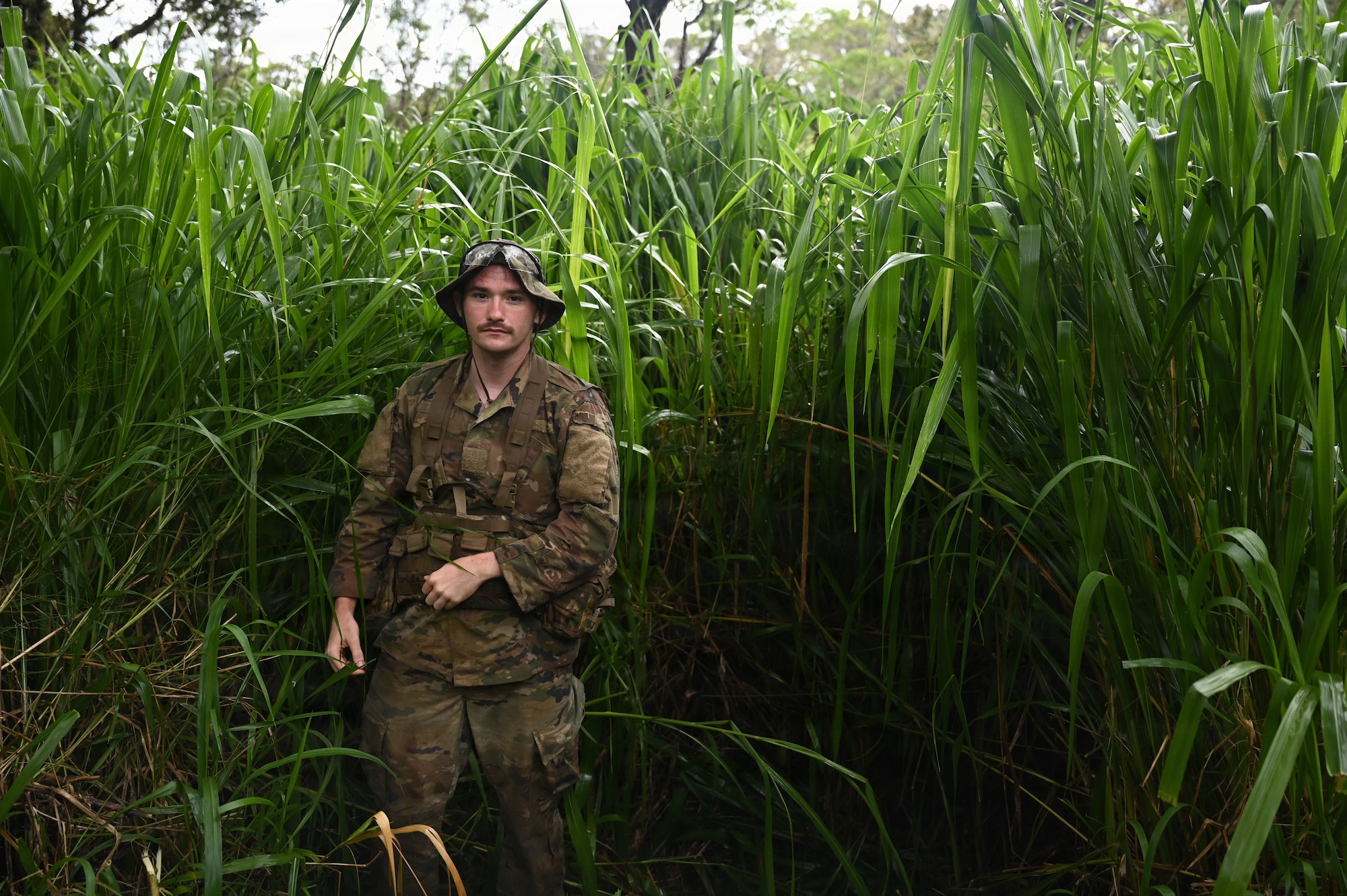 Senior Airman Brier Campbell, assigned to the Ohio Air National Guard's 178th Security Forces Squadron, poses for a photo during annual training at Schofield Barracks, Hawaii, July 23, 2026. The training challenges Airmen to strengthen tactical proficiency, teamwork and expeditionary readiness while operating in unfamiliar terrain and austere conditions. (U.S. Air National Guard photo by Tech. Sgt. Tiffany Scofield)