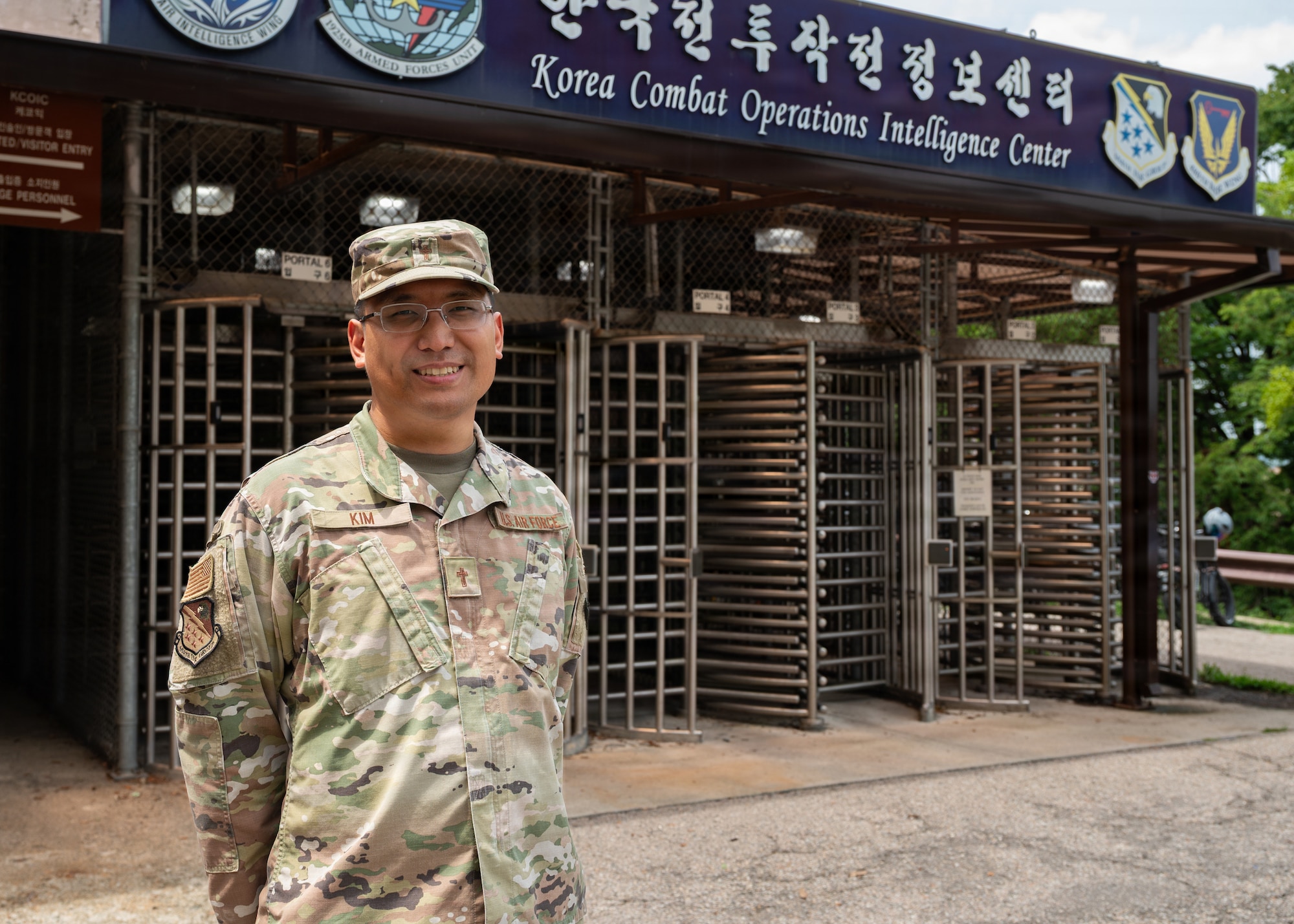Man poses in front of building