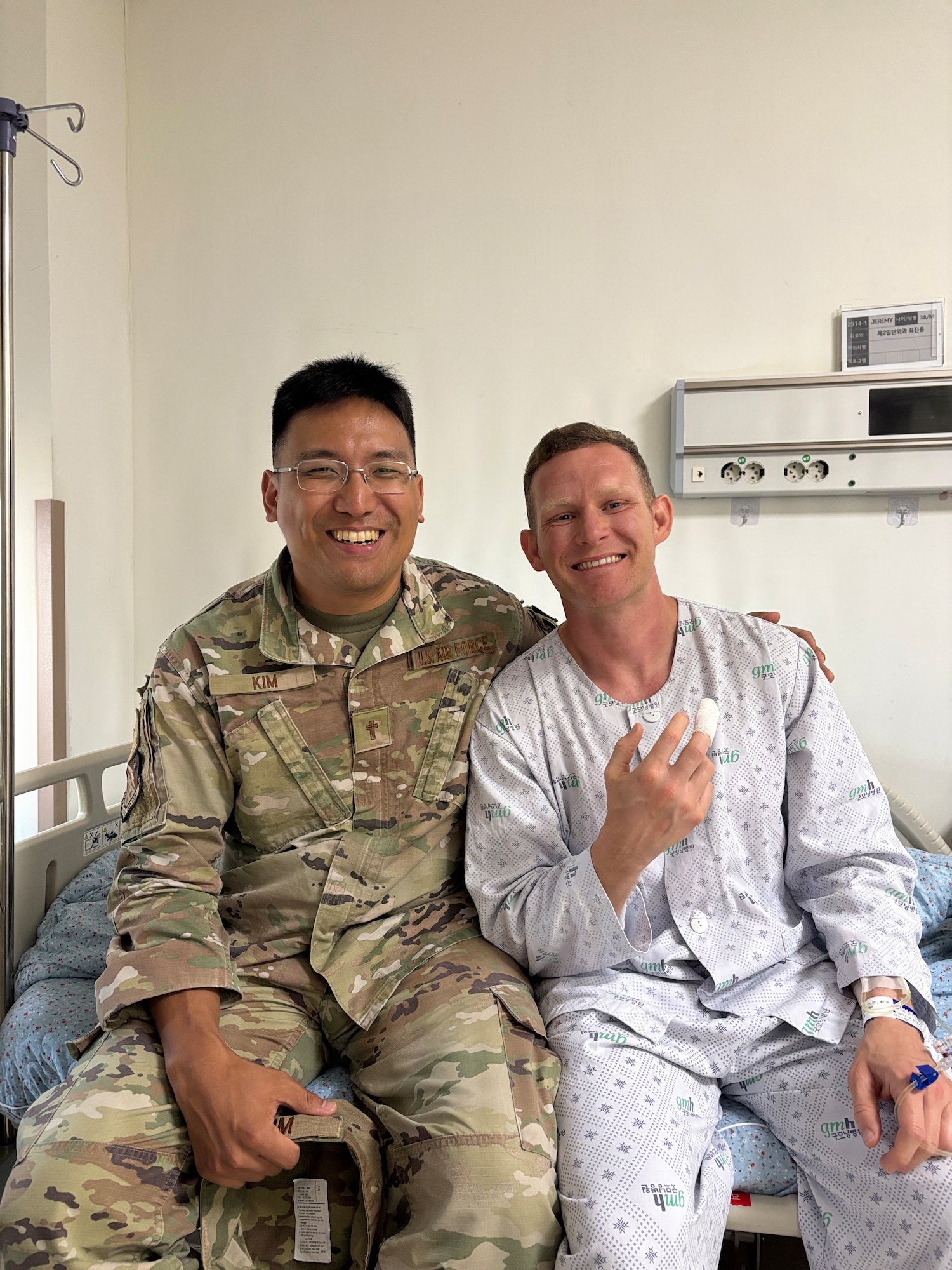 Two men pose for a photo