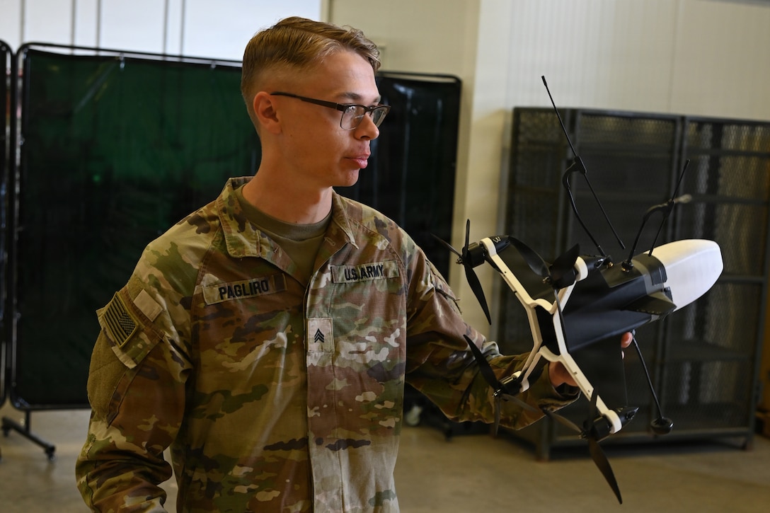 U.S. Army Sgt. Alexander Pagliro, Regimental Support Squadron, 2nd Cavalry Regiment, discussed his creative process for designing and building an interceptor drone from used parts and custom fabricated pieces during an open house at the 7th Army Training Command's  Design Innovation Research and Testing  Lab, Grafenwoehr, Germany, 31 July 2026. The DIRT Lab serves as a collaborative hub connecting Soldiers, engineers, and researchers to turn field-identified challenges into tangible solutions. Leveraging technologies like 3D printing, advanced manufacturing, robotics, and drones, empowering Soldiers to rapidly prototype and test capabilities designed by those closest to the challenges. (U.S. Army photo by Kevin Sterling Payne)
