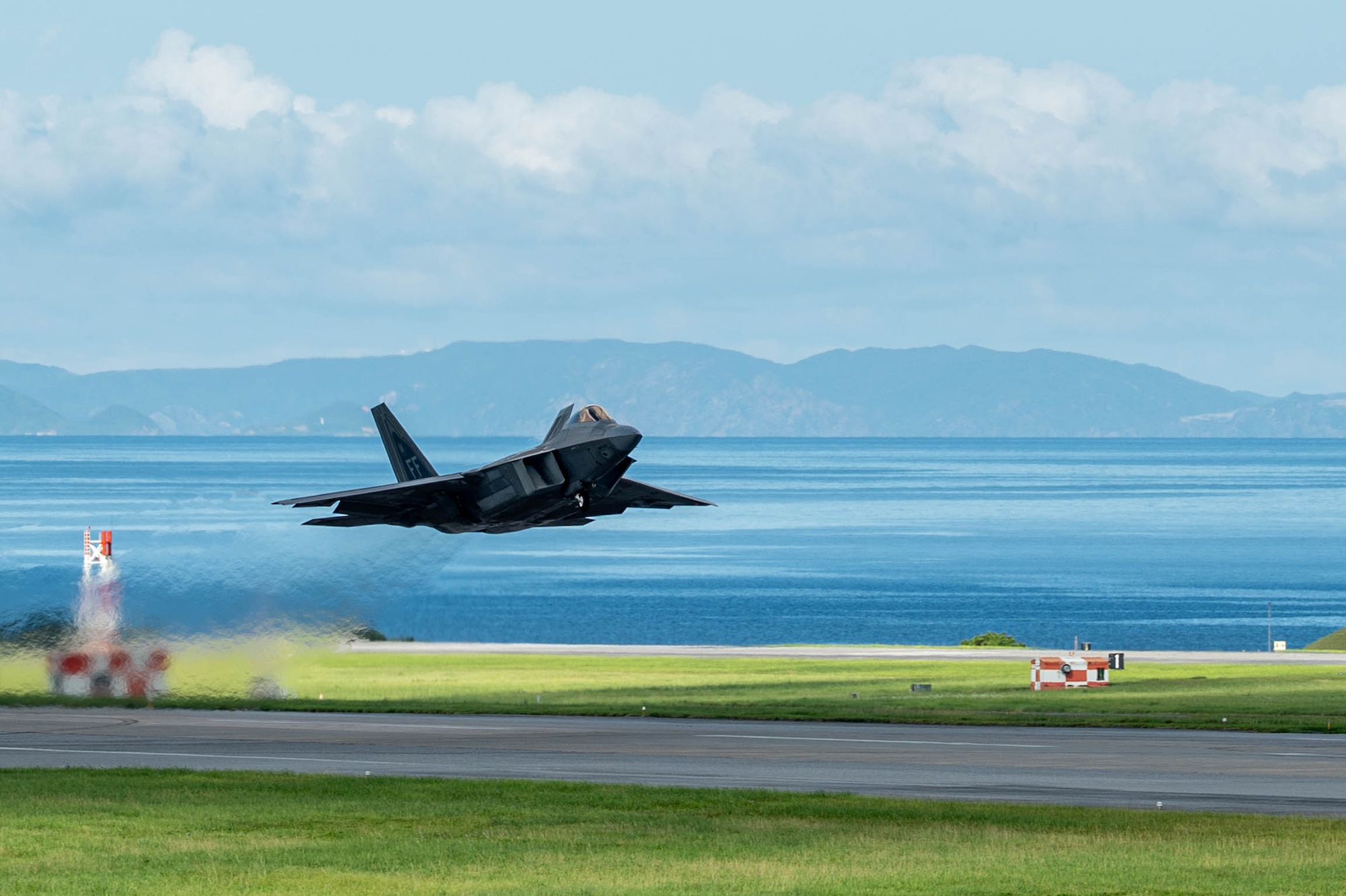 A U.S. Air Force F-22 Raptor assigned to the 27th Expeditionary Fighter Squadron, deployed to Kadena Air Base, takes off during readiness exercise BB26-1 at Kadena Air Base, Japan, Aug. 3, 2026. Exercises and operations incorporating agile combat employment concepts ensure forward-deployed forces in the Indo-Pacific are ready to protect and defend the United States, allied and partner interests at a moment’s notice. (U.S. Air Force photo by Senior Airman Violette Hosack)