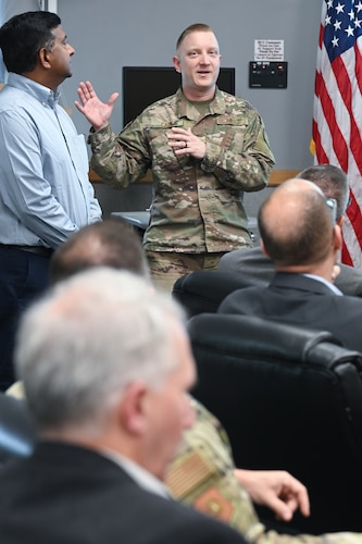 Lt. Col. Camdon Cady briefs lead scientists from across the Air Force during the Air Force Technology Horizons, Engineering, and Advisory Panel, here, July 21. The ATHENA panel consists of representatives who bridge the gap between the scientific community and various operational commands from across the Air Force. Kessel Run is a division focused on delivering resilient command and control and targeting software capabilities that provide operators with decision advantage. Cady is the materiel leader for Kessel Run’s Operational Command and Control branch. (Official Air Force photo by Richard Blumenstein).
