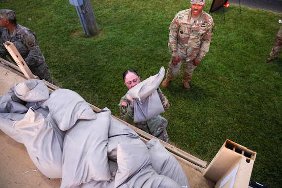 Army Sgt. 1st Class Heather Banda, a Talent Manager with the United States Army Human Resources Command (HRC), performs the 50M water-can carry, during the Combat Field Test (CFT), July 31, 2026 at Fort, Knox, Ky. (U.S. Army Reserve photo by Sgt. 1st Class Justin Hardin)