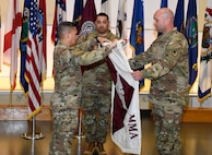 Col. Joselito "Joe" Lim, commander of the U.S. Army Medical Materiel Agency, inspects the unit colors during a USAMMA discontinuation ceremony July 31, 2026, at Fort Detrick, Maryland.