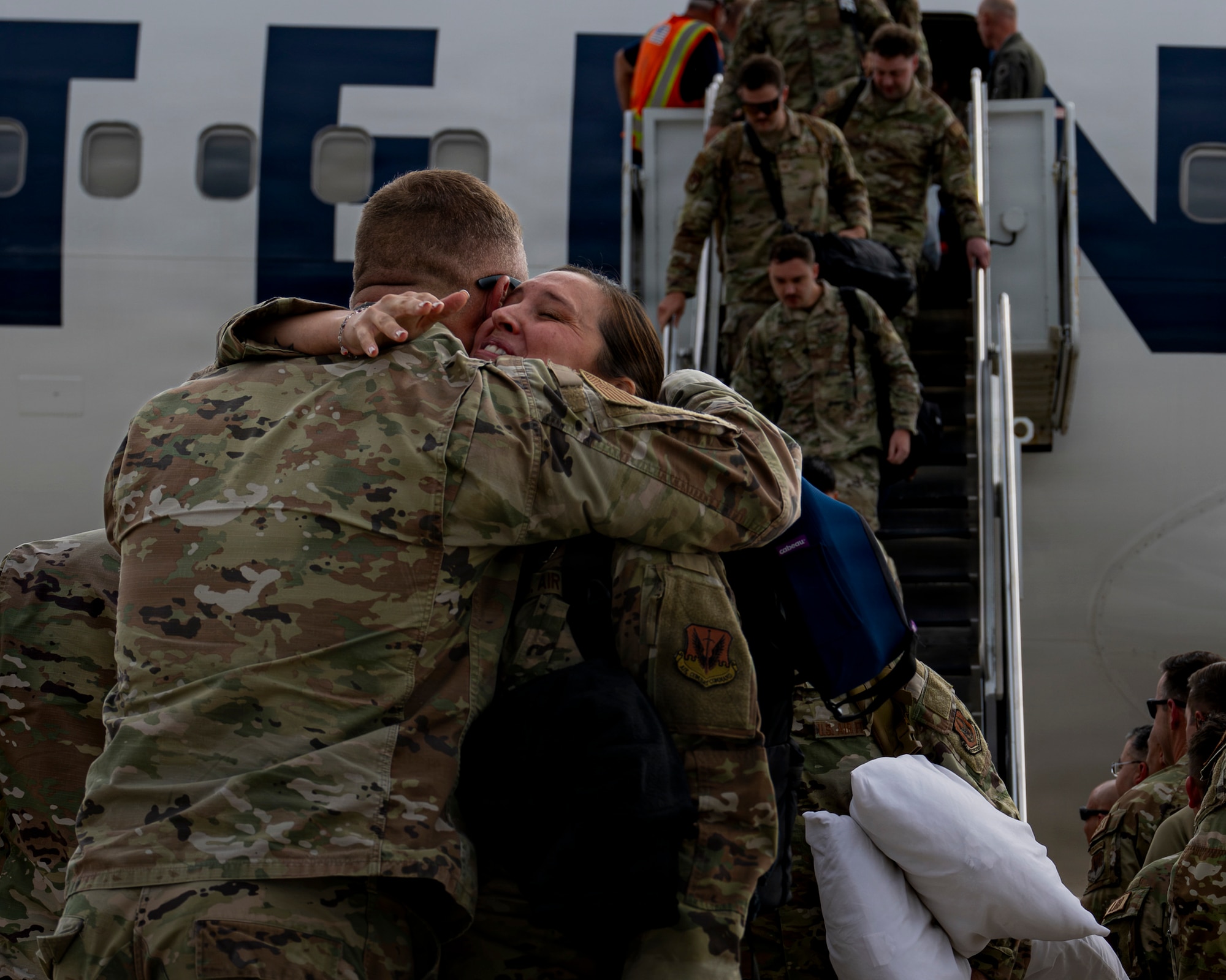 A photo of an airman returning from deployment