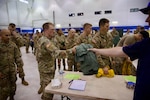 Washington National Guard Soldiers and Airmen receive their equipment from the Washington Department of Natural Resources before mobilization to the Little Giant Fire, Aug. 1, 2026, at the Army Aviation Sustainment Facility #2, Pangborn Field, East Wenatchee, Washington. Photo by Sgt. 1st Class Nicolas Cloward.