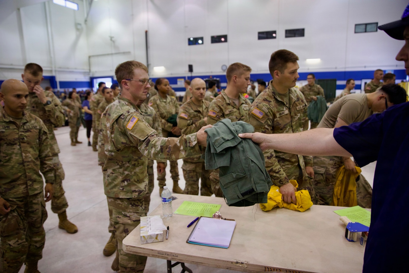 Washington National Guard Soldiers and Airmen receive their equipment from the Washington Department of Natural Resources before mobilization to the Little Giant Fire, Aug. 1, 2026, at the Army Aviation Sustainment Facility #2, Pangborn Field, East Wenatchee, Washington.