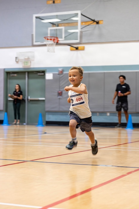 A young athlete takes part in the 20m beep test of the Presidential Fitness Test at Marine Corps Air Ground Combat Center Community Center, Twentynine Palms, California, July 23, 2026. The Presidential Fitness Test is for children ages 6 to 18 and encourages building strength, endurance, and healthy habits while striving for personal improvement. (U.S. Marine Corps photo by Lance Cpl. Cody Fitzgerald)