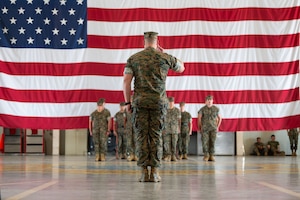 U.S. Marine Corps 1st Sgt. Brian Cooney, Marine Corps Detachment Goodfellow senior enlisted leader, salutes the flag after a relief and appointment ceremony, Goodfellow Air Force Base, Texas, July 24, 2026.