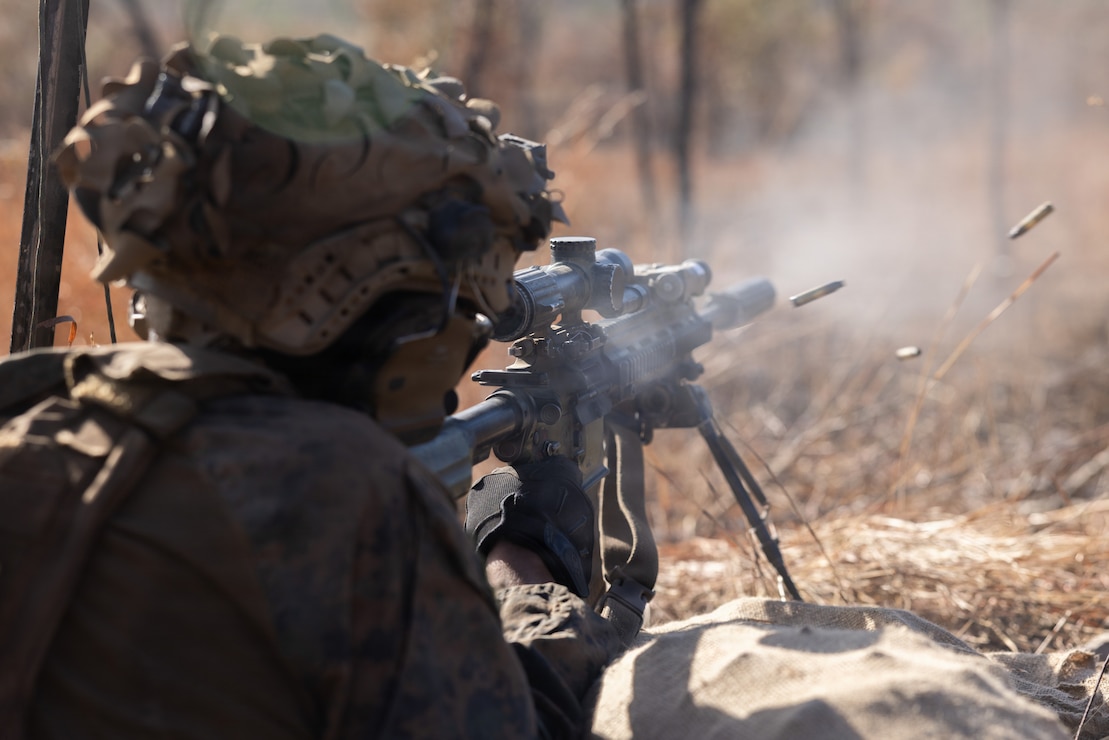U.S. Marine Corps Cpl. Benjamin Hernandez, an assistant patrol leader with 1st Battalion, 5th Marine Regiment, Marine Rotational Force – Darwin 26, fires an M4 carbine as part of a multinational live-fire drill during Exercise Predator’s Run 26 at Townsville Field Training Area in Queensland, Australia, July 27, 2026.