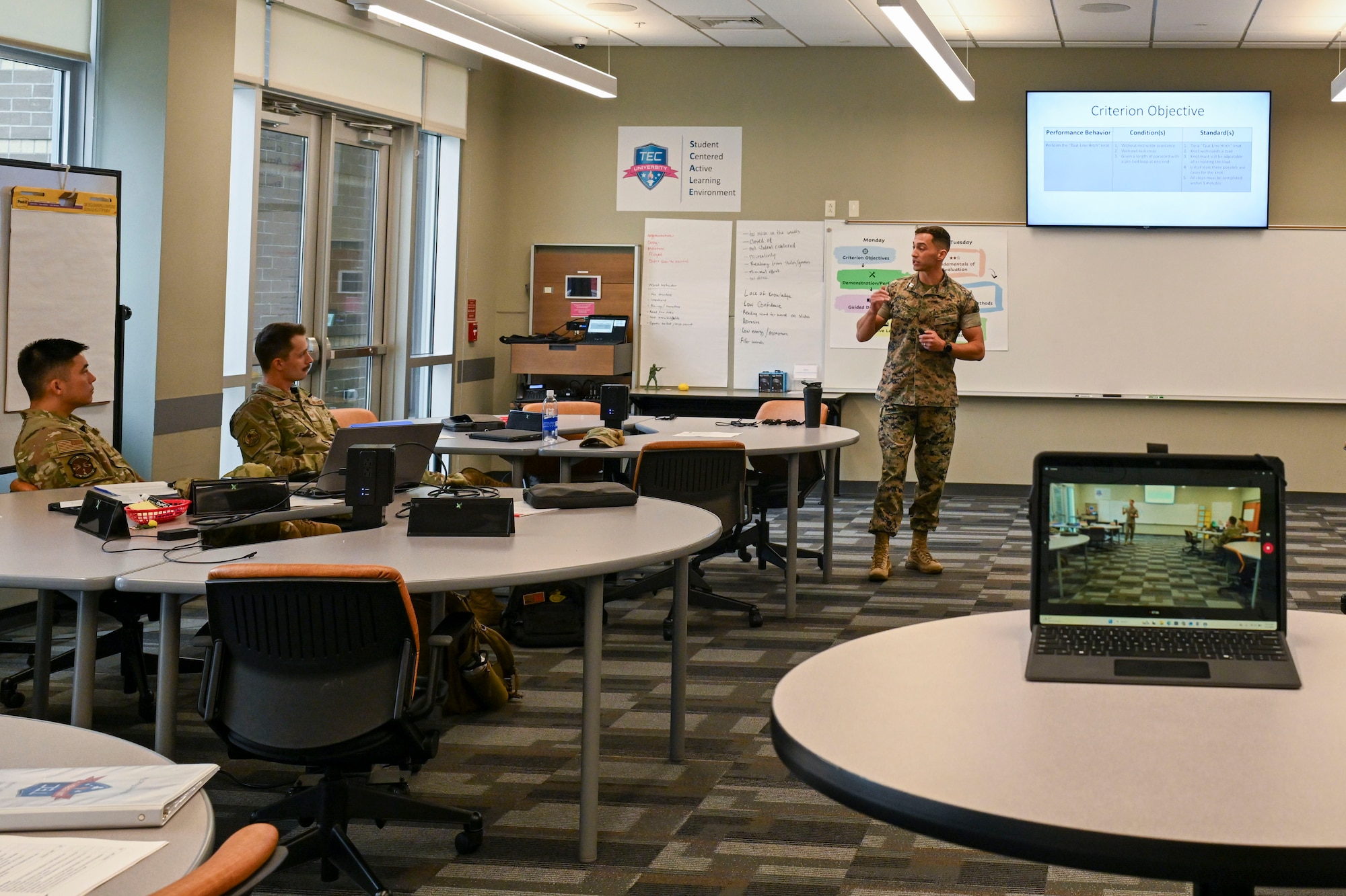 U.S. Marine Capt. Andrew Suarez, officer-in-charge of the Marine Corps Center for Learning and Faculty Development, Detachment West, Camp Pendleton, California,  talks with other students from the Air National Guard Instructor Course, McGhee Tyson Air National Guard Base, Tennessee, July 22, 2026.  A shared commitment to advancing instructor development brought the first U.S. Marine Corps participant to the I.G. Brown Training and Education Center’s TEC-University Air National Guard Instructor Course. (U.S. Air National Guard photo by Master Sgt. Regina Young)