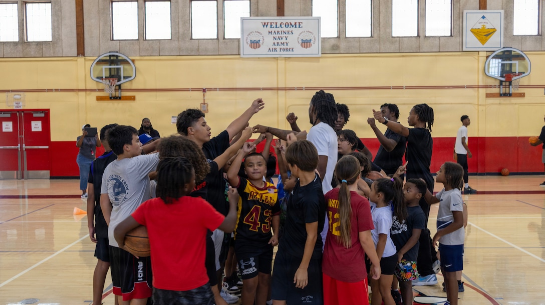 MARINE CORPS LOGISTICS BASE BARSTOW, Calif. — Local youth participated in a free youth basketball camp led by Christain Taylor, a professional international basketball player, at the Semper Fit base gym aboard Marine Corps Logistics Base Barstow, California, August 1. Taylor, a Barstow High School alumnus and former collegiate standout at Antelope Valley, currently plays overseas in the Albanian Superliga for Pogradeci. The community relations event, hosted by Marine Corps Community Services Barstow, provided specialized athletic training and mentorship to military-connected children of various age groups. (U.S. Marine Corps photos by Katherine Cortez, COMMSTRAT)