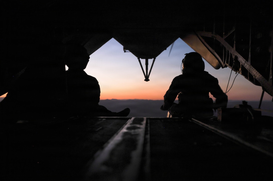 U.S. Marines with Heavy Marine Helicopter Squadron 462 (HMH-462), Marine Aircraft Group 16, 3rd Marine Aircraft Wing, fly on the back of a CH-53E Super Stallion during as part of Service Level Training Exercise 4-26 at Marine Corps Air Ground Combat Center, Twentynine Palms, California, July 27, 2026. SLTE is a premier training event that ensures the Marine Corps remains a highly lethal, adaptable force capable of dominating the future multi-domain fight. (U.S. Marine Corps photo by Lance Cpl. Lainey Brummett)