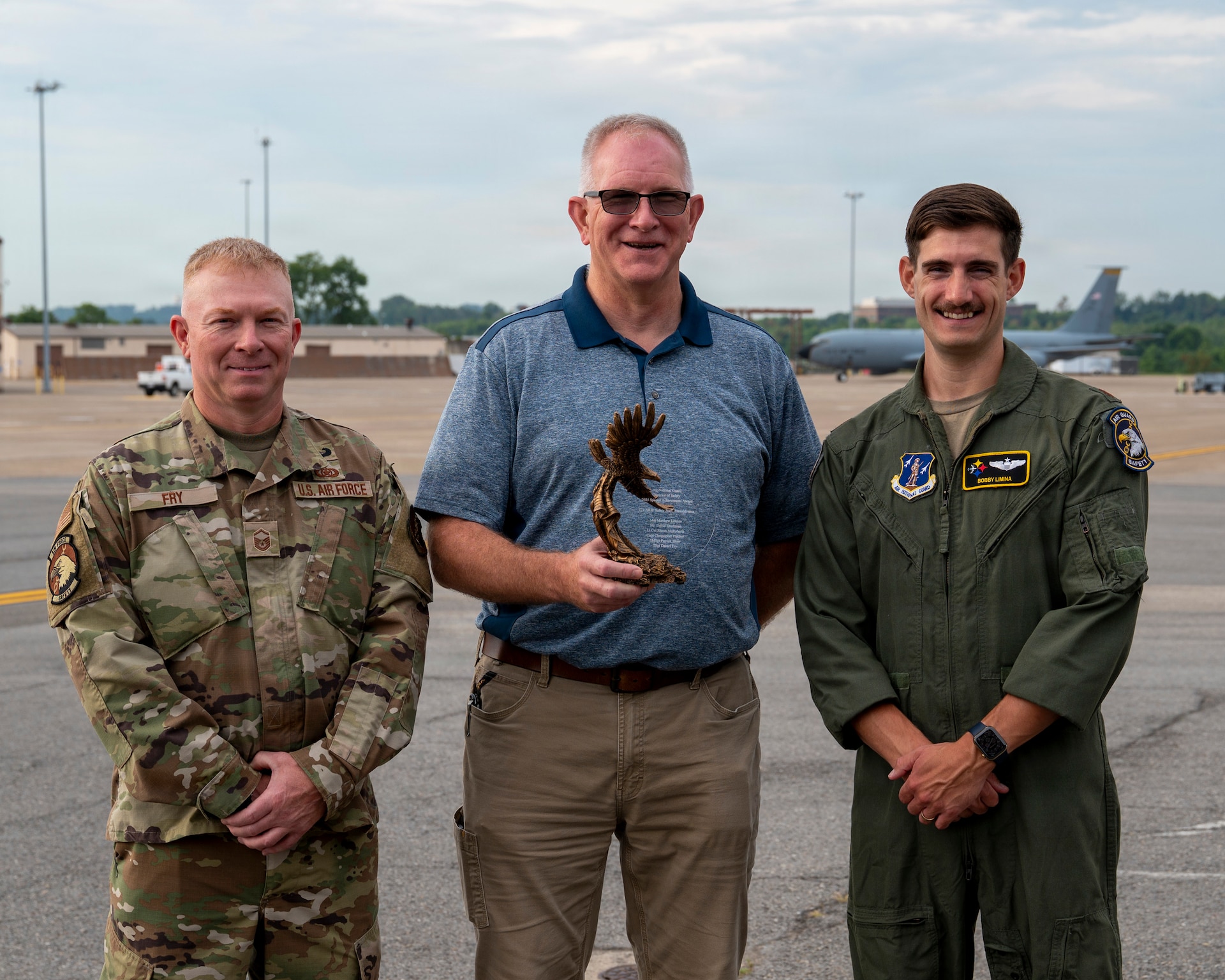 Master Sgt. Dan Fry, left, Dave Sparkman, center, and Maj. Matthew Limina, right, members of the 171st Air Refueling Wing Safety Team, pose for a photo at the 171st Air Refueling Wing, Aug. 1, 2026, near Pittsburgh, Pennsylvania. The 171st ARW Safety Office received the Air National Guard Director of Safety Outstanding Achievement Award for their contributions to mishap prevention, risk management, and safety program effectiveness. (U.S. Air National Guard photo by Tech. Sgt. Zoe M. Wockenfuss)