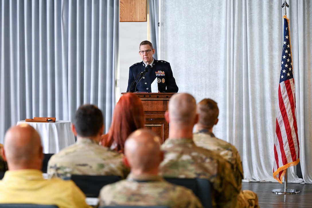 People in uniform at ceremony in building