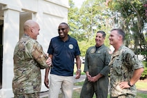 A group of people talk to each other at  Joint Base Charleston, South Carolina.