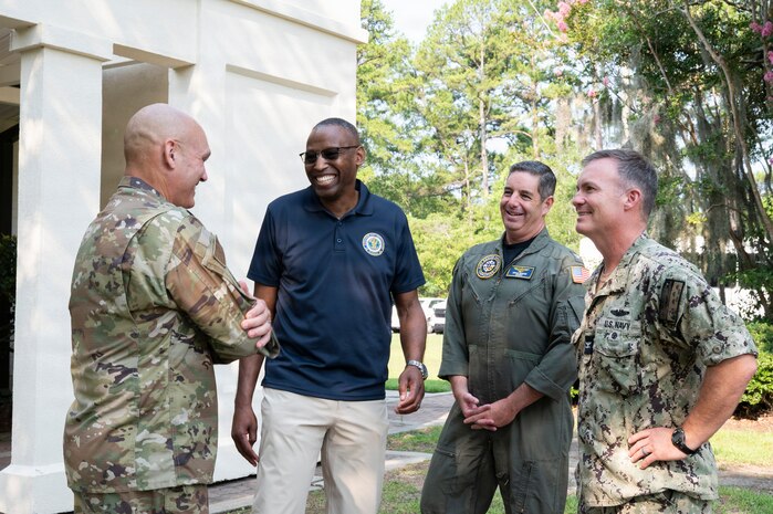 A group of people talk to each other at  Joint Base Charleston, South Carolina.