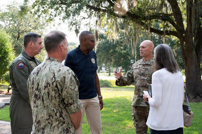 A group of people talk to each other at Joint Base Charleston, South Carolina.