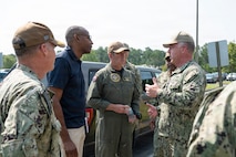 A group of people talk at Joint Base Charleston - Naval Weapons Station, South Carolina.