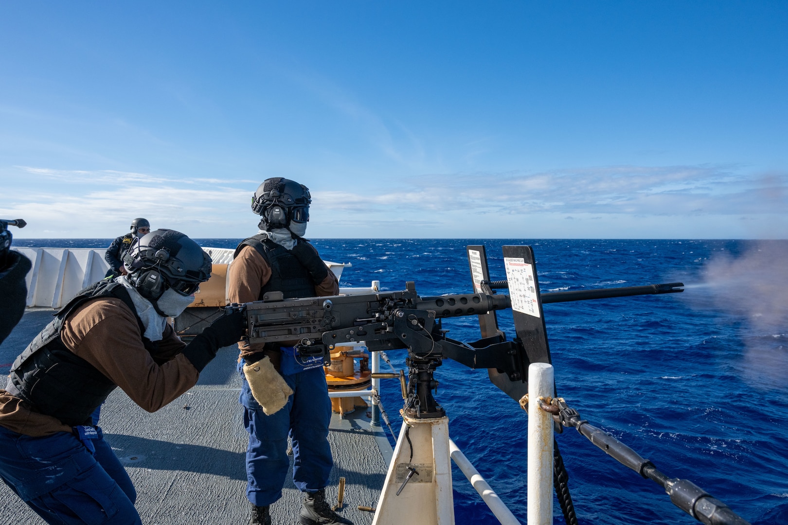 U.S. Coast Guardsmen shoot a 50-caliber machine gun aboard the Legend-class cutter USCGC Kimball (WMSL 756) during training in the Pacific Ocean, July 16, 2026. Thirty nations, 30 ships, five submarines, 15 national land forces, more than 190 aircraft and more than 30,000 personnel are participating in RIMPAC in and around the Hawaiian Islands, June 24 to July 31.