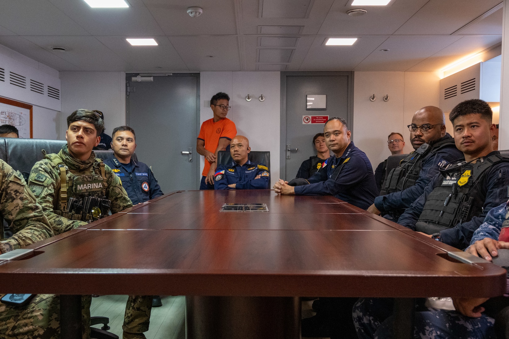 Mexican marines and sailors, Philippine coast guardsmen, and U.S. Coast Guardsmen go over law enforcement boarding procedures and techniques aboard the Philippine Navy offshore patrol vessel BRP Gabriela Silang (OPV-8301) in the Pacific Ocean, July 16, 2026. Thirty nations, 30 ships, five submarines, 15 national land forces, more than 190 aircraft and more than 30,000 personnel are participating in RIMPAC in and around the Hawaiian Islands, June 24 to July 31.