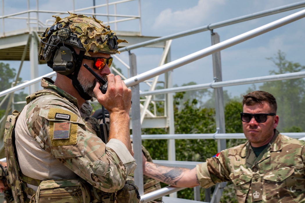 U.K Royal Air Force personnel using a communication device