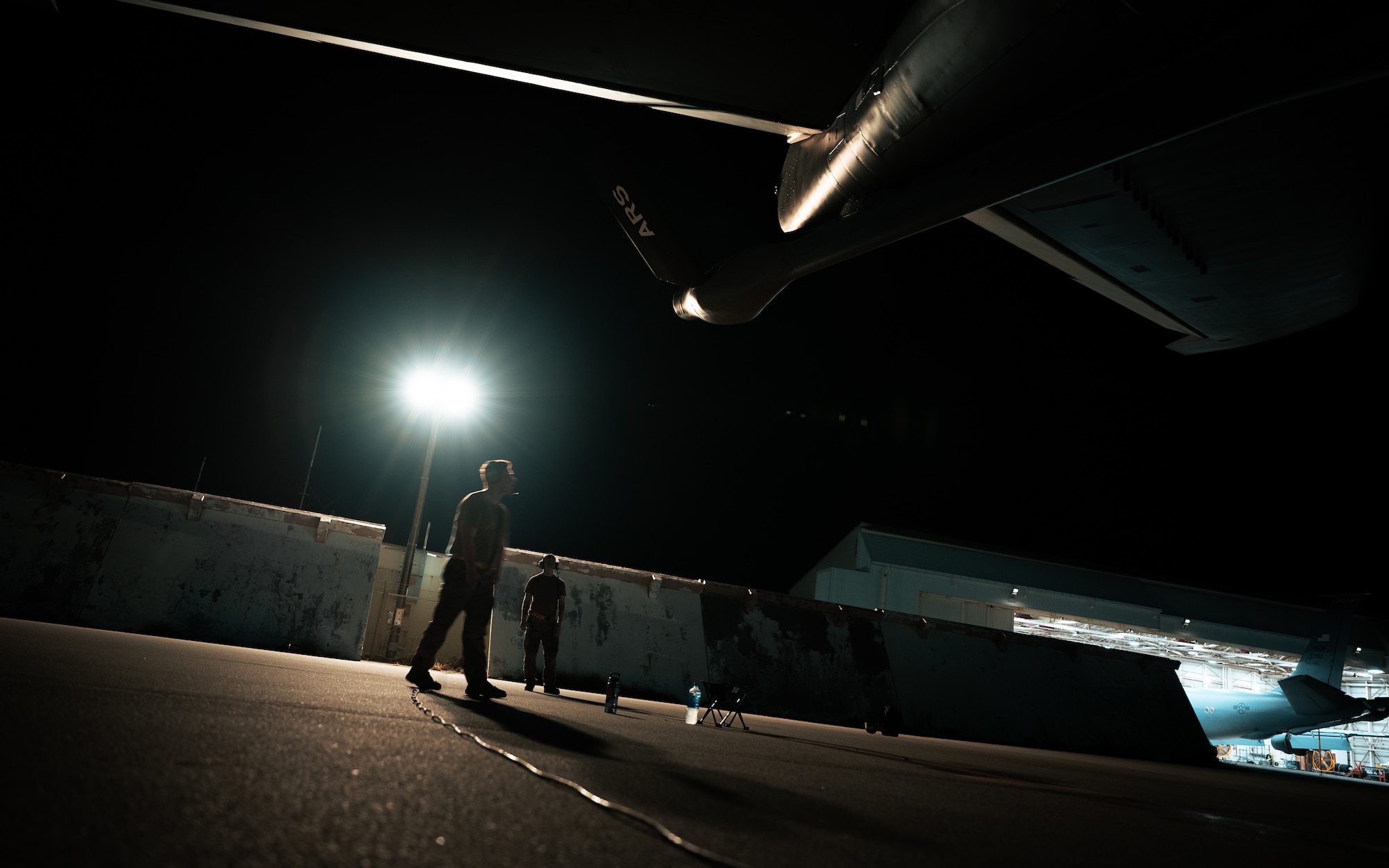 U.S. Air Force maintainers assigned to the 718th Aircraft Maintenance Squadron conduct preflight inspections on a KC-135 Stratotanker assigned to the 909th Air Refueling Squadron at Kadena Air Base, Japan, Aug. 3, 2026. Maintainers verified the aircraft’s systems and equipment before its possible evacuation ahead of Typhoon Dolphin. (U.S. Air Force photo by Senior Airman Mason Hargrove)