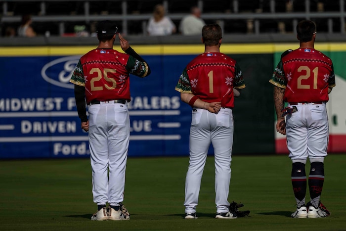 Jay Thomason, U.S. Air Force Academy graduate and Wind Surge utility player, stands at attention and salutes alongside his teammates during the national anthem at Equity Bank Park in Wichita, Kansas, July 25, 2026. Thomason graduated from the Academy in 2024 and was drafted by the Minnesota Twins baseball organization and currently plays for their affiliate team. (U.S. Air Force photo by Airman 1st Class Tavian Sims)