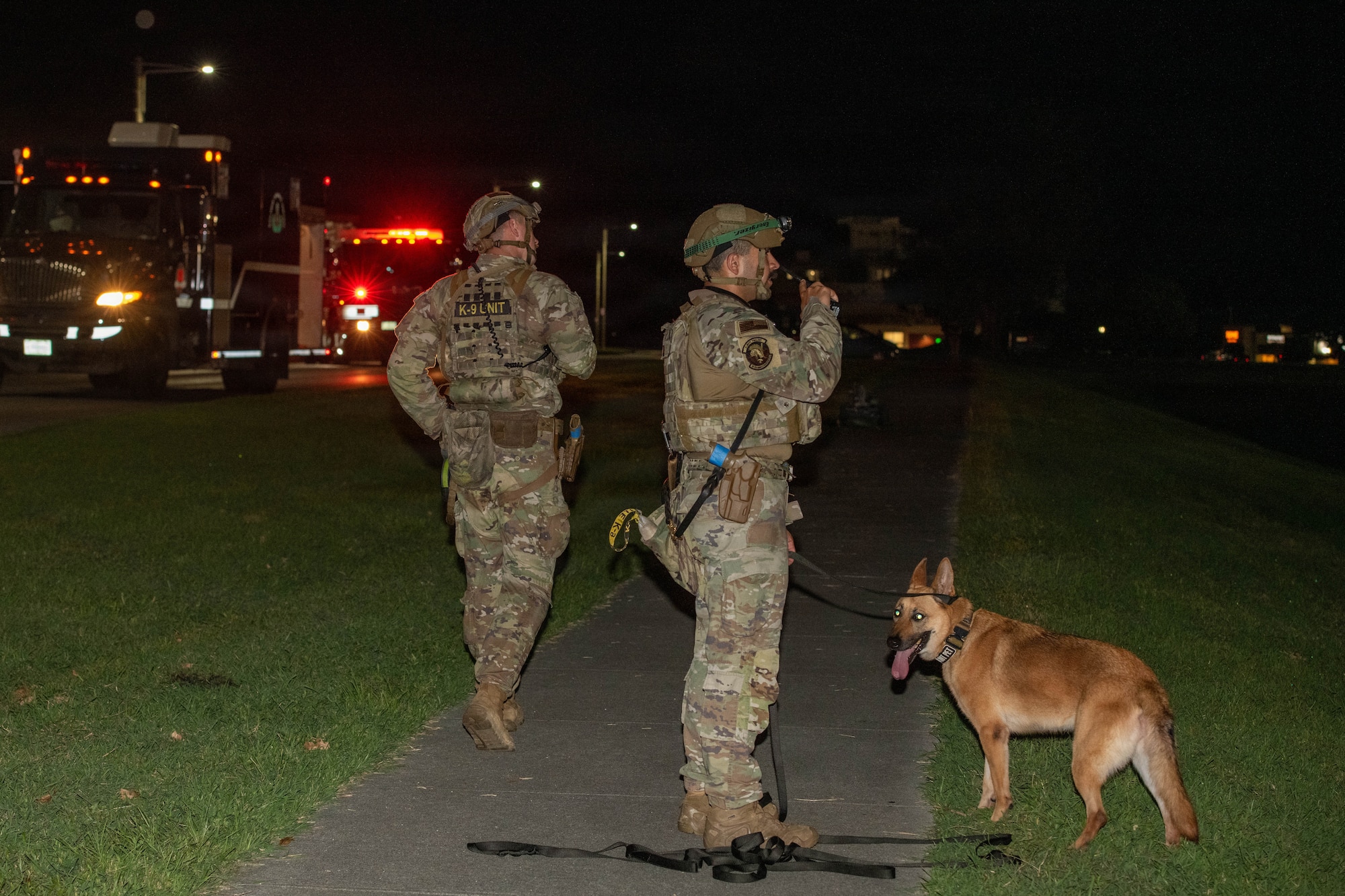 Service members sweep area.
