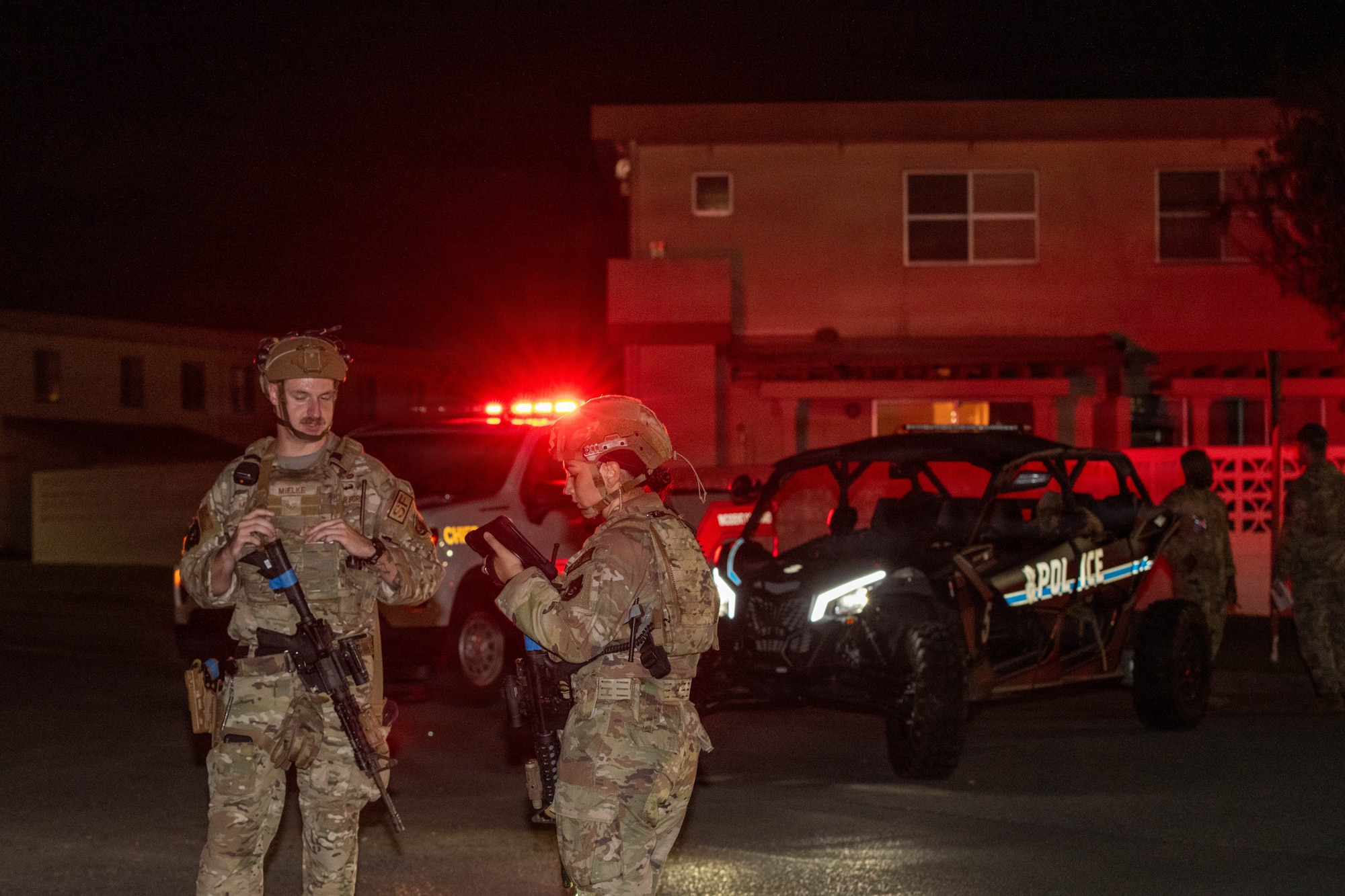 Service members sweep area.