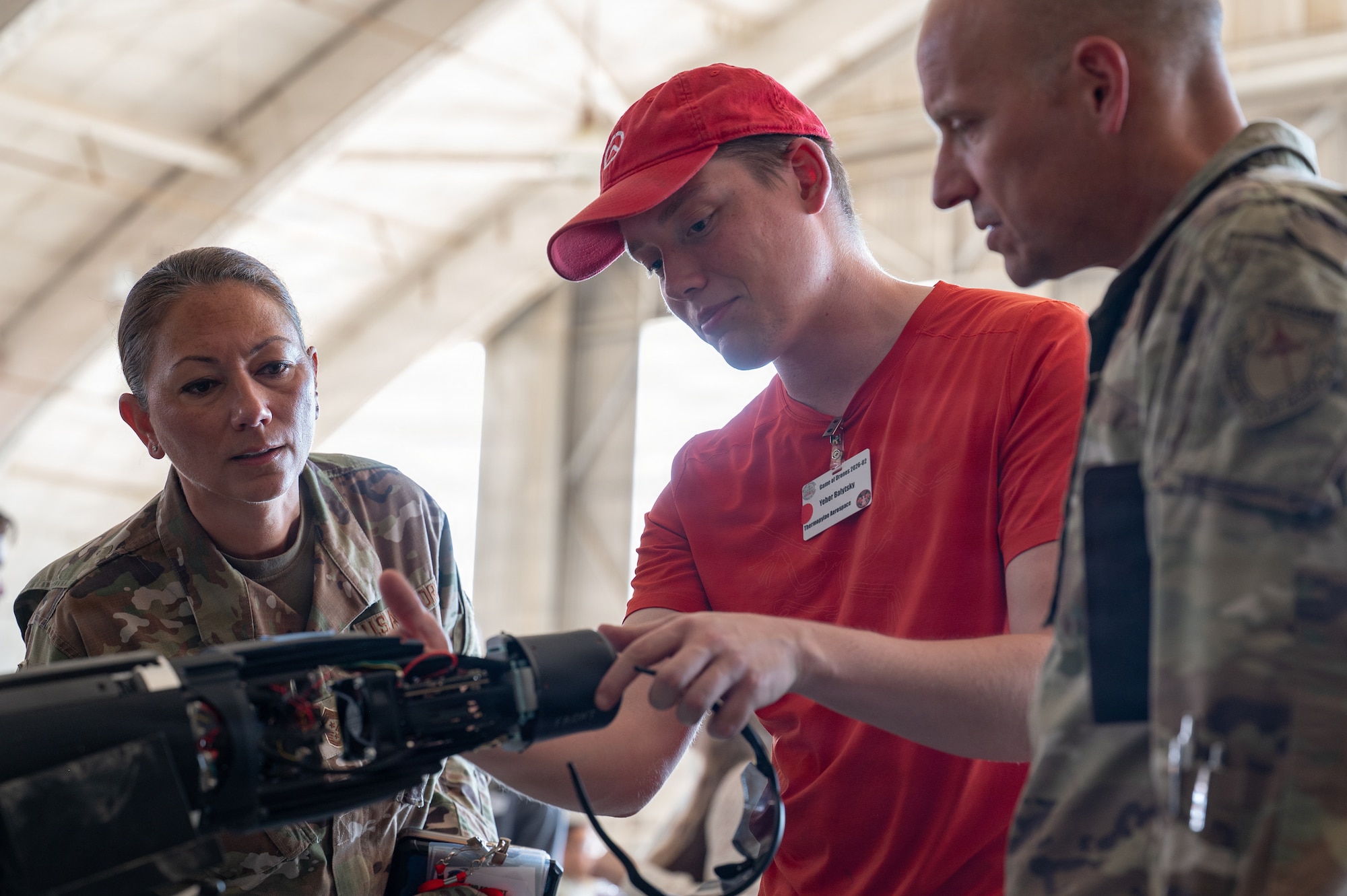 Yehor Balytskyi, founder and chief executive officer of Thermopylae Aerospace, briefs Brig. Gen. Mark Massaro, commander of the Air Force Test Center, and Chief Master Sgt. Sevin Balkuvvar, Air Force Test Center command chief, during the “Game of Drones” event at Edwards Air Force Base, California, July 16, 2026. The event provided Air Force leaders with an opportunity to engage directly with industry innovators demonstrating emerging autonomous and counter-small unmanned aerial system technologies while discussing their potential applications for future testing and operational use. These evaluations will help accelerate placement onto the sUAS Blue List, strengthening efforts to meet the Secretary of War’s Drone Dominance initiative. (U.S. Air Force photo by Tech. Sgt. Robert Cloys)