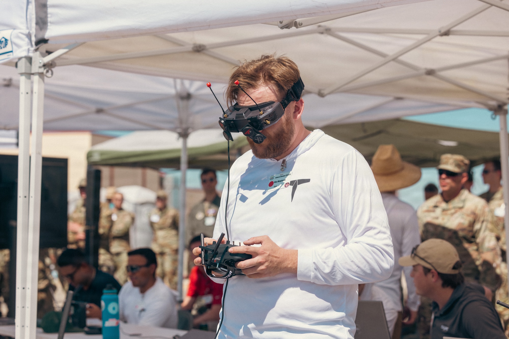 Max Magilnick of Titan Dynamics prepares a rapidly 3D-printed sUAS asset for demonstration during "Game of Drones" 26-2 at Edwards Air Force Base, California, on June 16, 2026. Hosted by the 412th Test Wing’s Experimental Test Force, in collaboration with the Defense Contract Management Agency’s US-X unit, the event supports the Air Force Test Center’s mission to accelerate the evaluation of autonomous technologies through collaborative experimentation and rapid user feedback. These evaluations will help accelerate placement onto the sUAS Blue List, strengthening efforts to meet the Secretary of War’s Drone Dominance initiative. (U.S. Air Force photo by Brandon Hernandez)