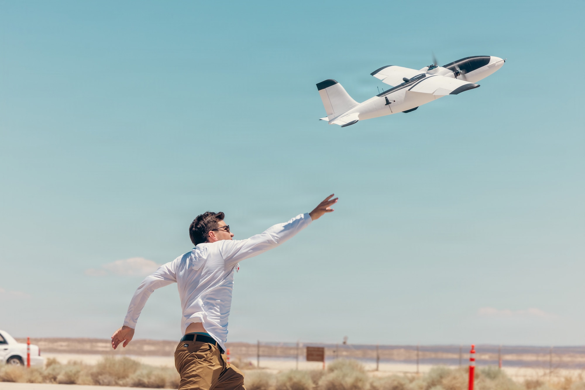 Noah Benton of Titan Dynamics launches a rapidly produced sUAS during "Game of Drones" 26-2 at Edwards Air Force Base, California on June 16, 2026. Hosted by the 412th Test Wing’s Experimental Test Force, in collaboration with the Defense Contract Management Agency’s US-X unit, the event supports the Air Force Test Center’s mission to accelerate the evaluation of autonomous technologies through collaborative experimentation and rapid user feedback. These evaluations will help accelerate placement onto the sUAS Blue List, strengthening efforts to meet the Secretary of War’s Drone Dominance initiative. (U.S. Air Force photo by Brandon Hernandez)
