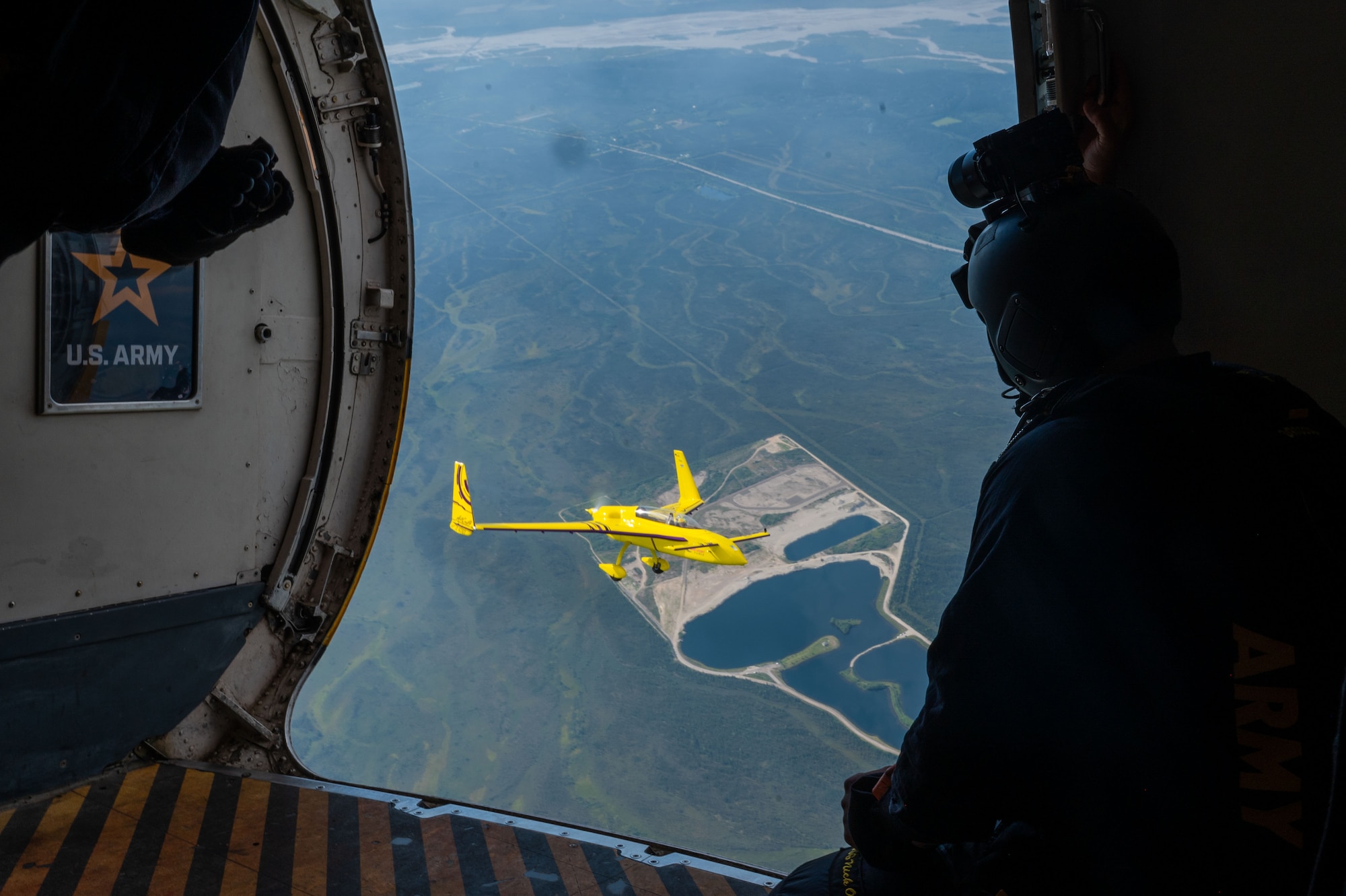 Kyle Fowler flies his homebuilt aircraft, the Rutan model 61 Long-EZ, next to the U.S. Army Golden Knights Parachute Team during the Arctic Lightning Air Show on Eielson Air Force Base, Alaska, July 31, 2026.