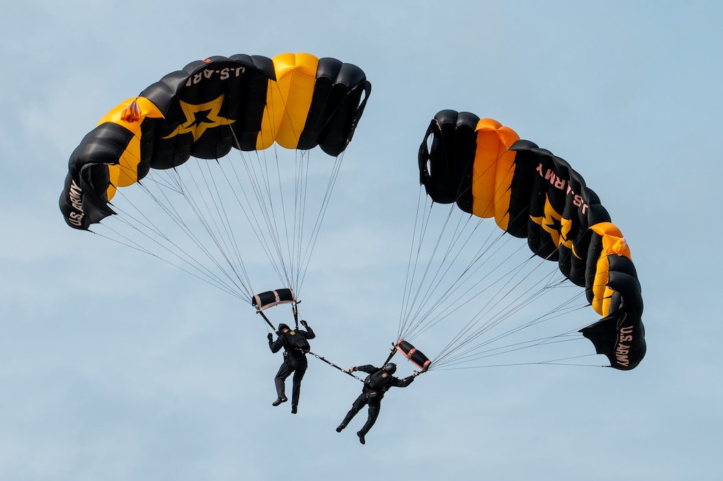 Members of the U.S. Army Golden Knights Parachute Team descend during a demonstration at the Arctic Lightning Air Show at Eielson Air Force Base, Alaska, Aug. 2, 2026.