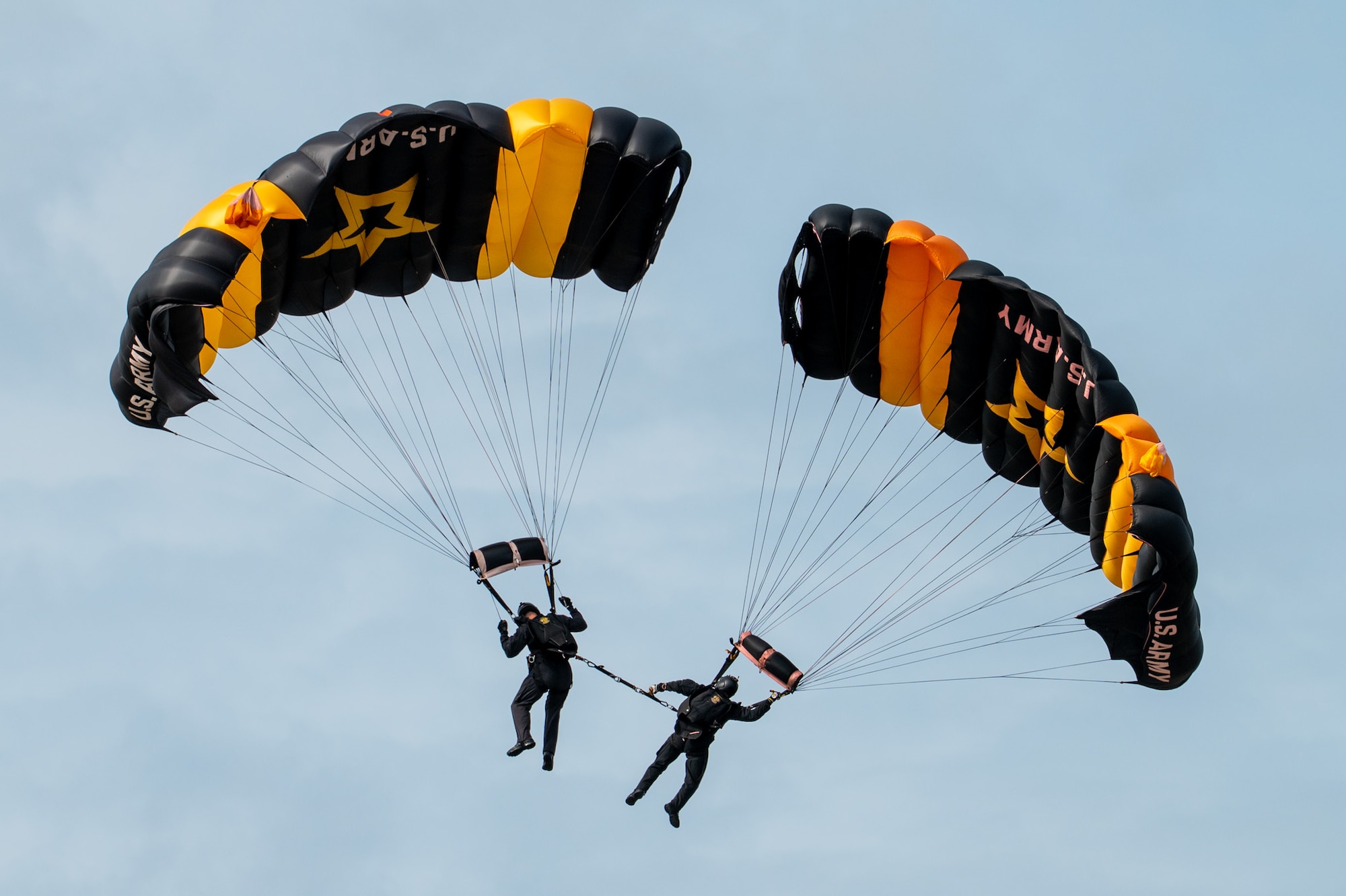 Members of the U.S. Army Golden Knights Parachute Team descend during a demonstration at the Arctic Lightning Air Show at Eielson Air Force Base, Alaska, Aug. 2, 2026.