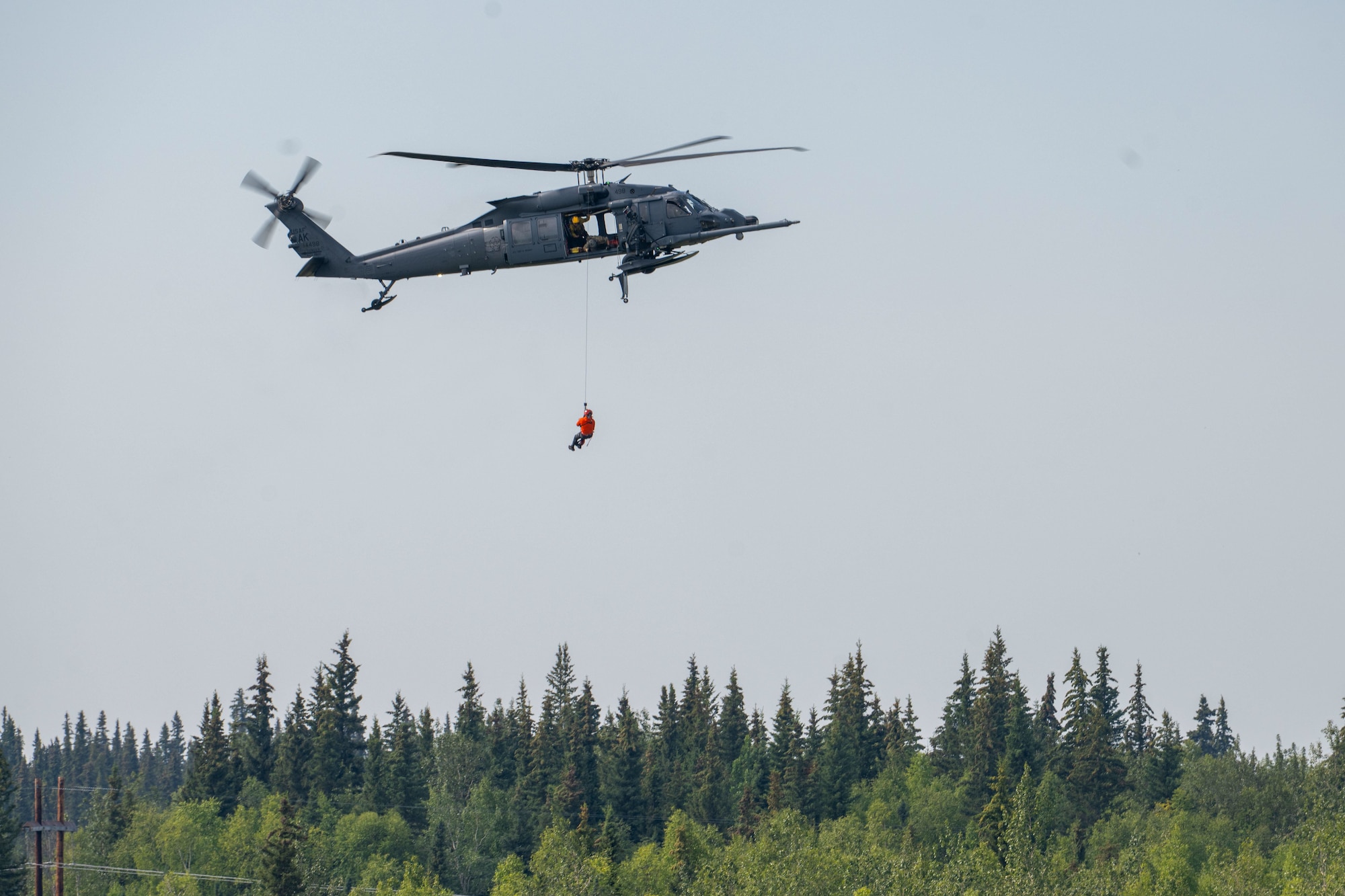A U.S. Air Force HH-60 Pavehawk assigned to the 210th Rescue Squadron performs an aerial demonstration during the Arctic Lightning Air Show at Eielson Air Force Base, Alaska, July 31, 2026.