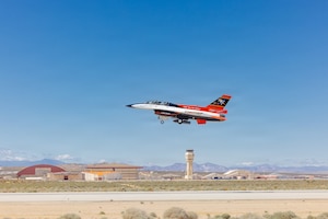 Rachel Kinard, Air Force Test Pilot School director of research, and Lt. Col. Philip Downing, 370th Flight Test Squadron commander, depart for a HAVE HEAT test mission at Edwards Air Force Base, California, April 16, 2026. Leveraging Lockheed Martin’s Infrared Search and Track Legion Pod, during the HAVE HEAT program, the X-62 VISTA platform demonstrated the ability of AI agents to ingest live infrared sensor data, directing the X-62 to autonomously intercept an airborne target in real time. (U.S. Air Force photo by Lindsey Iniguez)