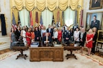 President Donald J. Trump, senior War Department leaders and members of the President's Military Spouse Commission pose for a photo following the president signing the group into existence via executive order at the White House, Aug. 3, 2026.