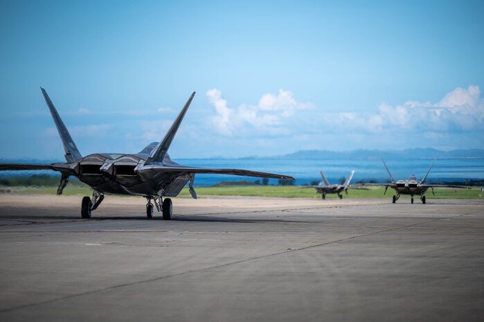 U.S. Air Force F-22 Raptors assigned to the 27th and 90th Expeditionary Fighter Squadrons, deployed to Kadena Air Base, taxi to the runway during readiness exercise BB26-1 at Kadena Air Base, Japan, Aug. 3, 2026. Kadena Air Base’s training is critical to deterring aggression and being ready to fight and win to protect the vital interests of the U.S. and Japan. (U.S. Air Force photo by Airman 1st Class Nathaniel Jackson)