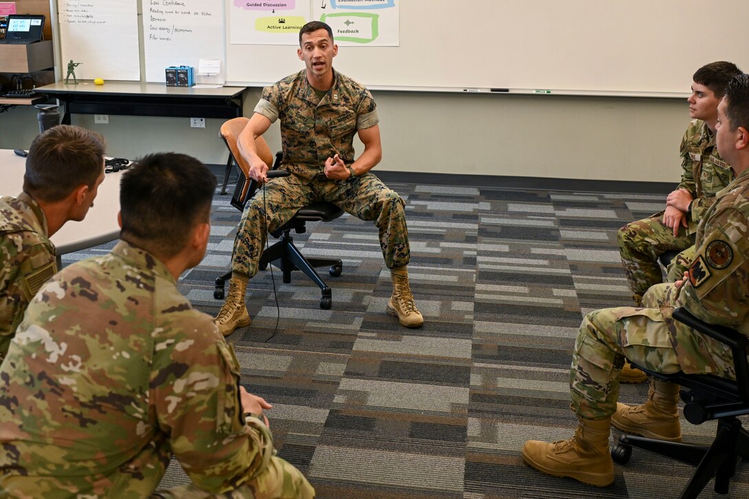 U.S. Marine Capt. Andrew Suarez, officer-in-charge of the Marine Corps Center for Learning and Faculty Development, Detachment West, Camp Pendleton, California, prepares to demonstrate a task to Air National Guard Instructor Course students, McGhee Tyson Air National Guard Base, Tennessee, July 22, 2026.  A shared commitment to advancing instructor development brought the first U.S. Marine Corps participant to the I.G. Brown Training and Education Center’s TEC-University Air National Guard Instructor Course. (U.S. Air National Guard photo by Master Sgt. Regina Young)