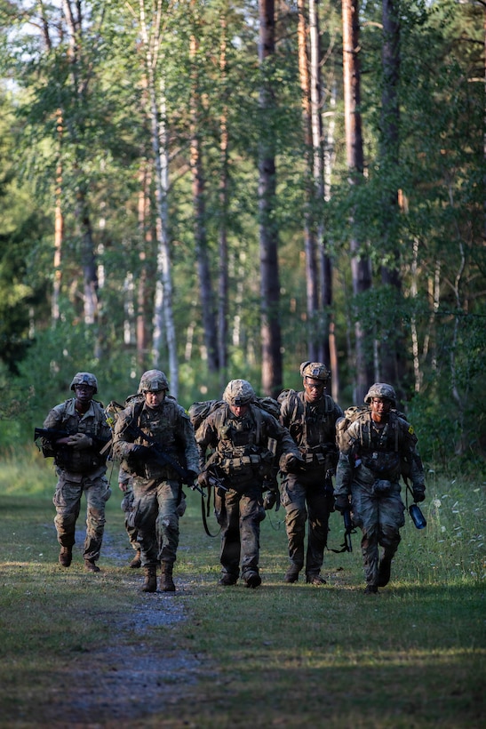 U.S. Soldiers, with the 16th Sustainment Brigade, ruck 12 miles during the U.S. Army Europe and Africa Best Squad Competition at Grafenwoehr Training Area, Germany,  Aug. 2, 2026. Teams across U.S. Army Europe and Africa meet at Grafenwoehr Training Area, Germany, to compete for the title of Best Squad, July 30-August 6, 2026. The event tests the squad’s effectiveness, communication, and overall cohesion, as well as the individual Soldier’s technical and tactical proficiency, endurance, and fortitude. This competitive training event exercises a full range of squad-level skills, highlighting professional excellence and knowledge to determine the command’s top teams. Winners of this competition will advance to represent U.S. Army Europe and Africa at the Army Best Squad Competition. (U.S. Army Reserve photo by Sgt. Addison Shinn)