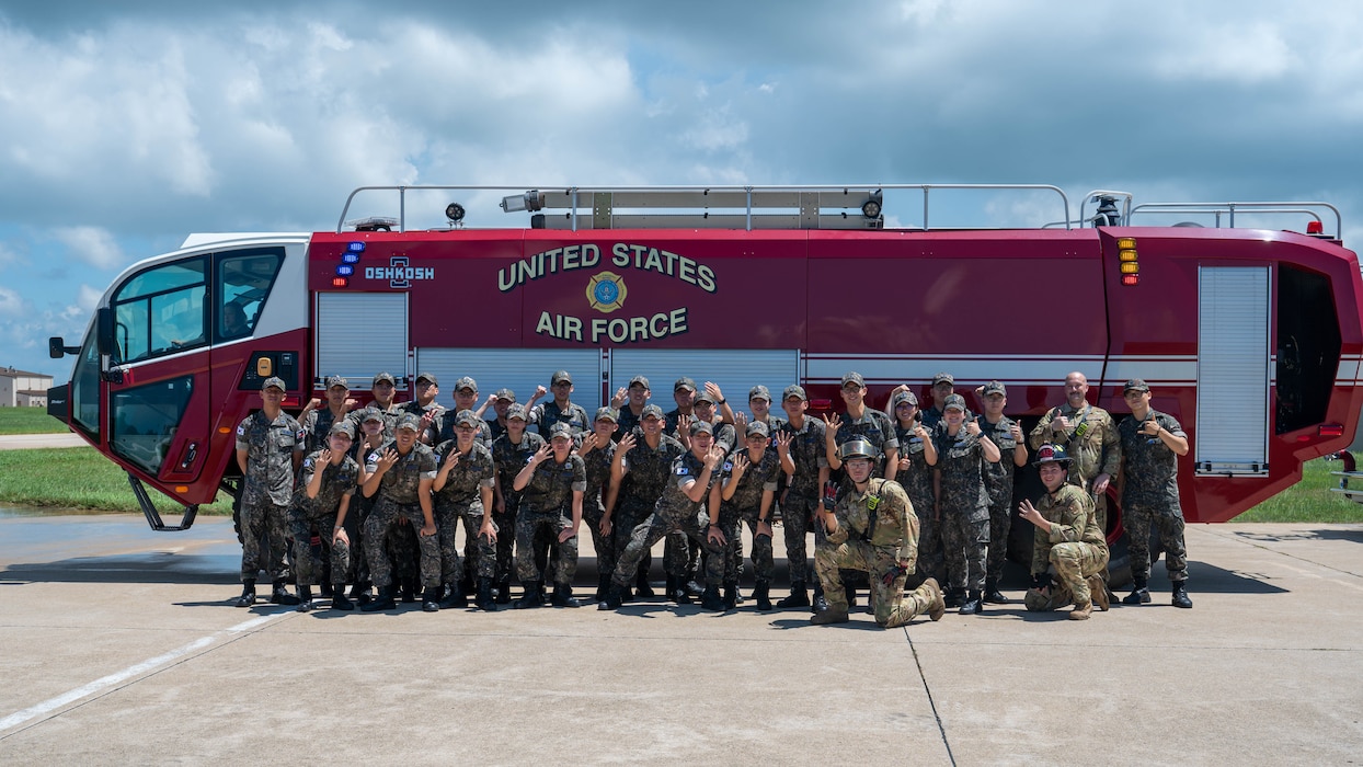 U.S. Air Force Airmen assigned to the 8th Fighter Wing and Republic of Korea Air Force Academy cadets gather for a group photo during a tour at Kunsan Air Base, ROK, July 30, 2026. Cadets visited the Wolf Pack to explore joint capabilities, mission readiness and interoperability alongside U.S. Air Force and Marine Corps service members, reinforcing the enduring strength of the U.S.-ROK Alliance and the future of our partnership. (U.S. Air Force photo by Staff Sgt. Cedrique Oldaker)