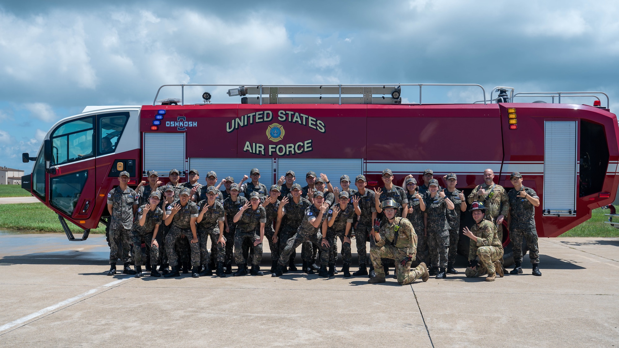 U.S. Air Force Airmen assigned to the 8th Fighter Wing and Republic of Korea Air Force Academy cadets gather for a group photo during a tour at Kunsan Air Base, ROK, July 30, 2026. Cadets visited the Wolf Pack to explore joint capabilities, mission readiness and interoperability alongside U.S. Air Force and Marine Corps service members, reinforcing the enduring strength of the U.S.-ROK Alliance and the future of our partnership. (U.S. Air Force photo by Staff Sgt. Cedrique Oldaker)