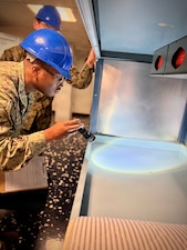 Naval Medical Readiness and Training Command Hospital Corpsman 2nd Class Shamar Johnson serving with the Public Health Department at Naval Hospital Pensacola conducts a Ship Sanitation Control Certificate inspection aboard the USNS Comfort (T-AH-20) July 8, 2026. The inspection, performed by Preventive Medicine Technicians (PMTs), evaluates the vessel's sanitation, potable water systems, food safety practices, pest  management, and overall public health conditions to ensure compliance with  health standards.