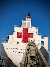 Naval Medical Readiness and Training Command Sailors serving with the Public Health Department at Naval Hospital Pensacola board the USNS Comfort (T-AH-20) to conduct a Ship Sanitation Control Certificate inspection July 8, 2026. The inspection, performed by Preventive Medicine Technicians (PMTs), evaluates the vessel's sanitation, potable water systems, food safety practices, pest  management, and overall public health conditions to ensure compliance with  health standards.